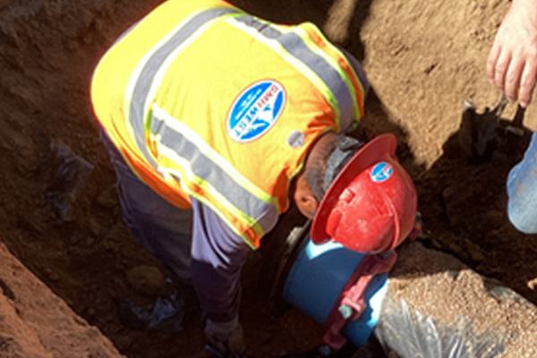 SMH West crew member working in the trench