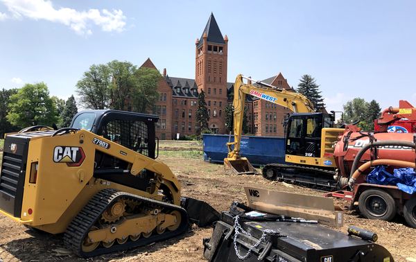 CAT skid steer and excavator staged on an SMH West jobsite